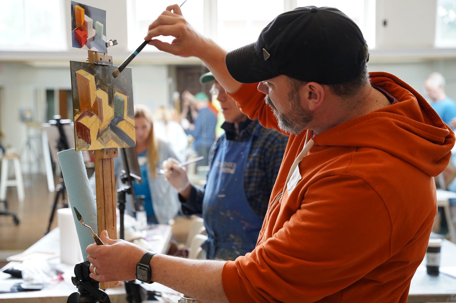 Artists painting in a workshop